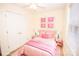 A charming pink bedroom featuring a comfortable bed and ample closet space at 3309 E Broad St, Statesville, NC 28625