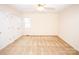 A neutral bedroom with carpet flooring, ample closet space, and natural lighting at 3309 E Broad St, Statesville, NC 28625