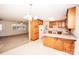 Bright eat-in kitchen with wooden cabinets and adjacent dining area at 3309 E Broad St, Statesville, NC 28625