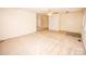 Open living room with neutral walls, carpet flooring, and a ceiling fan at 3309 E Broad St, Statesville, NC 28625