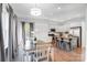 Kitchen and dining area with hardwood floors, white cabinets, and gray island at 356 Nantucket Way, Rock Hill, SC 29732