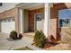 Brick front porch with gray door and welcome sign at 356 Nantucket Way, Rock Hill, SC 29732