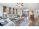 Living room with hardwood floors, neutral colored couch, and large TV at 356 Nantucket Way, Rock Hill, SC 29732