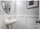 Modern powder room with pedestal sink and wainscoting at 356 Nantucket Way, Rock Hill, SC 29732