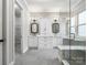 Elegant bathroom featuring dual vanities, a walk-in shower, and modern finishes at 4104 Granite Cir, Indian Land, SC 29707