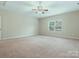 Spacious bedroom with neutral carpet, ceiling fan and a bright window at 4104 Granite Cir, Indian Land, SC 29707