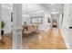 Elegant dining room featuring hardwood floors, a crystal chandelier, and ample natural light at 4104 Granite Cir, Indian Land, SC 29707