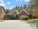 Charming two-story home featuring brick and stone exterior, manicured landscaping and attached two-car garage at 4104 Granite Cir, Indian Land, SC 29707