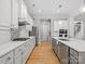 Well-lit kitchen with stainless steel appliances, a large island, and a modern backsplash at 4104 Granite Cir, Indian Land, SC 29707