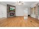 Spacious living room featuring a stone fireplace, hardwood floors, and natural light at 4104 Granite Cir, Indian Land, SC 29707