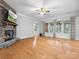 Spacious living room featuring a stone fireplace, hardwood floors, and natural light at 4104 Granite Cir, Indian Land, SC 29707