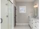 Modern bathroom with marble vanity and walk-in shower at 419 Sylvania Ave, Charlotte, NC 28206