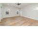 Bedroom with light hardwood floors and ceiling fan at 419 Sylvania Ave, Charlotte, NC 28206