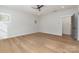 Bright bedroom with hardwood floors and ceiling fan at 419 Sylvania Ave, Charlotte, NC 28206