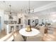 Kitchen with island and dining area with white table and chairs at 419 Sylvania Ave, Charlotte, NC 28206