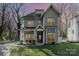 Gray two-story house with a front porch and landscaped lawn at 419 Sylvania Ave, Charlotte, NC 28206