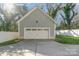 Detached garage with off-street parking and a large door at 419 Sylvania Ave, Charlotte, NC 28206