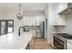 Spacious kitchen with white cabinets, marble countertops, and stainless steel appliances at 419 Sylvania Ave, Charlotte, NC 28206