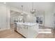 Modern kitchen featuring a large island, white cabinets, and stainless steel appliances at 419 Sylvania Ave, Charlotte, NC 28206