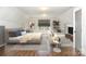 Main bedroom with sitting area, hardwood floors, and stylish decor at 419 Sylvania Ave, Charlotte, NC 28206