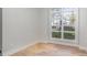 Bright home office featuring hardwood floors and a large window at 419 Sylvania Ave, Charlotte, NC 28206