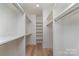 Large walk-in closet with ample shelving and hanging space at 419 Sylvania Ave, Charlotte, NC 28206