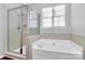 Bathroom with soaking tub and walk-in shower at 711 Torrey Pines Ln, Fort Mill, SC 29715