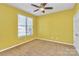 Bright bedroom with neutral walls and ceiling fan at 711 Torrey Pines Ln, Fort Mill, SC 29715