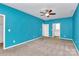 Teal bedroom with carpet, ceiling fan, and en-suite bathroom at 711 Torrey Pines Ln, Fort Mill, SC 29715