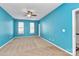 Spacious bedroom with teal walls and neutral carpeting at 711 Torrey Pines Ln, Fort Mill, SC 29715