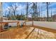 Wooden deck with white railing and view of trees and sky at 711 Torrey Pines Ln, Fort Mill, SC 29715