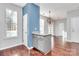 Kitchen with island and breakfast bar, hardwood floors at 711 Torrey Pines Ln, Fort Mill, SC 29715