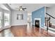 Bright living room with hardwood floors, fireplace, and large windows at 711 Torrey Pines Ln, Fort Mill, SC 29715