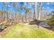 Landscaped backyard with stone path leading to fire pit area at 911 Wildwood Dr, Kings Mountain, NC 28086