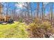 Elevated deck with built-in grill and wooded backyard view at 911 Wildwood Dr, Kings Mountain, NC 28086