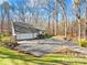 Ranch style home with attached two-car garage, surrounded by trees at 911 Wildwood Dr, Kings Mountain, NC 28086