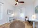 Bright bedroom with hardwood floors, built-in shelving, and workspace at 1019 Trembeth Dr, Charlotte, NC 28205