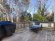 Wooden deck with small table and chairs, overlooking backyard at 1019 Trembeth Dr, Charlotte, NC 28205