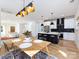 Open concept dining room with light hardwood floors and a view into the kitchen at 1019 Trembeth Dr, Charlotte, NC 28205