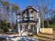 Two-story house with gray and white siding, a front porch, and a landscaped yard at 1019 Trembeth Dr, Charlotte, NC 28205