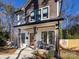 Two-story house with gray and white siding, a front porch, and a landscaped yard at 1019 Trembeth Dr, Charlotte, NC 28205