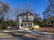 Two-story house with gray and white siding, a front porch, and a landscaped yard at 1019 Trembeth Dr, Charlotte, NC 28205