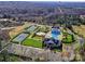 Aerial view of community amenities including pool, tennis courts, and playground at 11307 Miller Rd # 101, Pineville, NC 28134