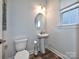 Clean and updated bathroom with pedestal sink and oval mirror at 11307 Miller Rd # 101, Pineville, NC 28134