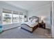 Spacious bedroom with large windows and plush carpeting at 11307 Miller Rd # 101, Pineville, NC 28134