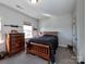 Bedroom with wood dresser and double bed at 11307 Miller Rd # 101, Pineville, NC 28134