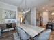 Elegant dining room showcasing a marble table and statement light fixture at 11307 Miller Rd # 101, Pineville, NC 28134