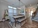 Bright dining room features a marble table, gray chairs, and stylish light fixture at 11307 Miller Rd # 101, Pineville, NC 28134