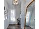 Light and airy entryway with a full-length mirror and stylish light fixture at 11307 Miller Rd # 101, Pineville, NC 28134