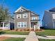 Two-story craftsman home with gray siding and landscaping at 11307 Miller Rd # 101, Pineville, NC 28134